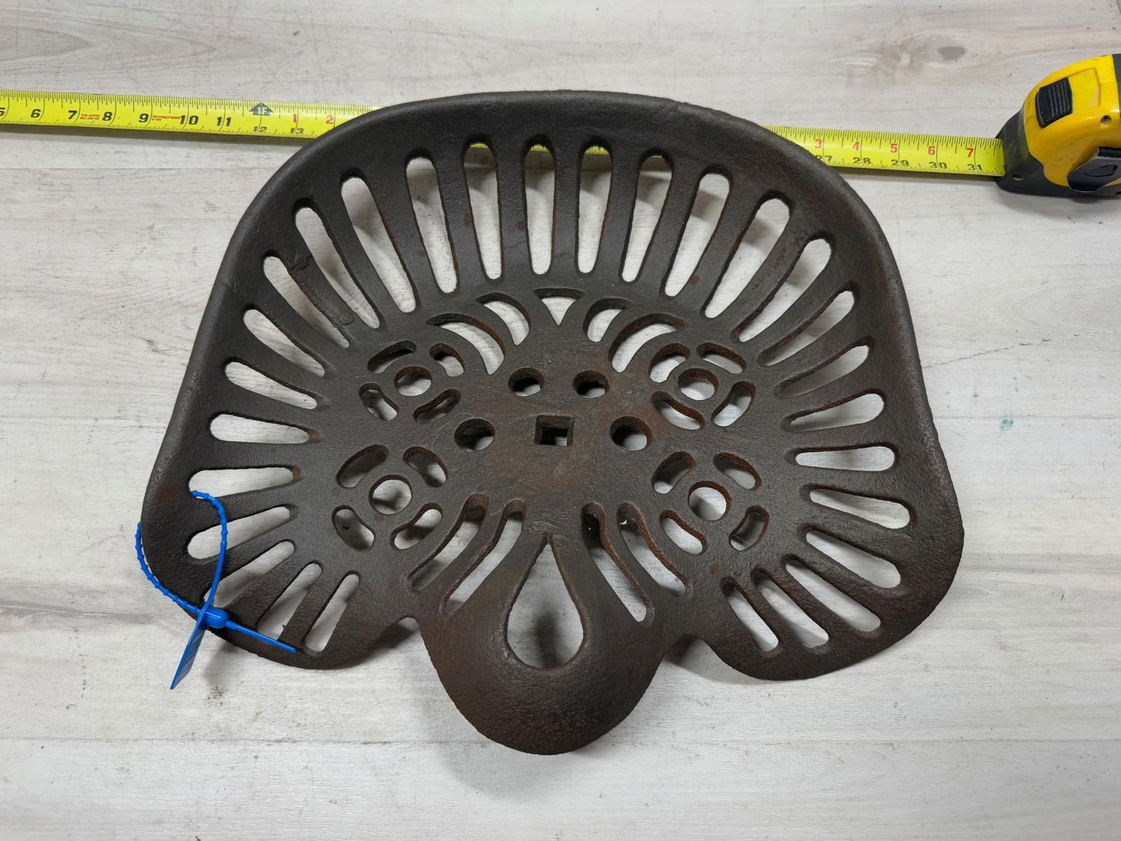 Unmarked cast iron tractor/ implement seat (1 of 3)