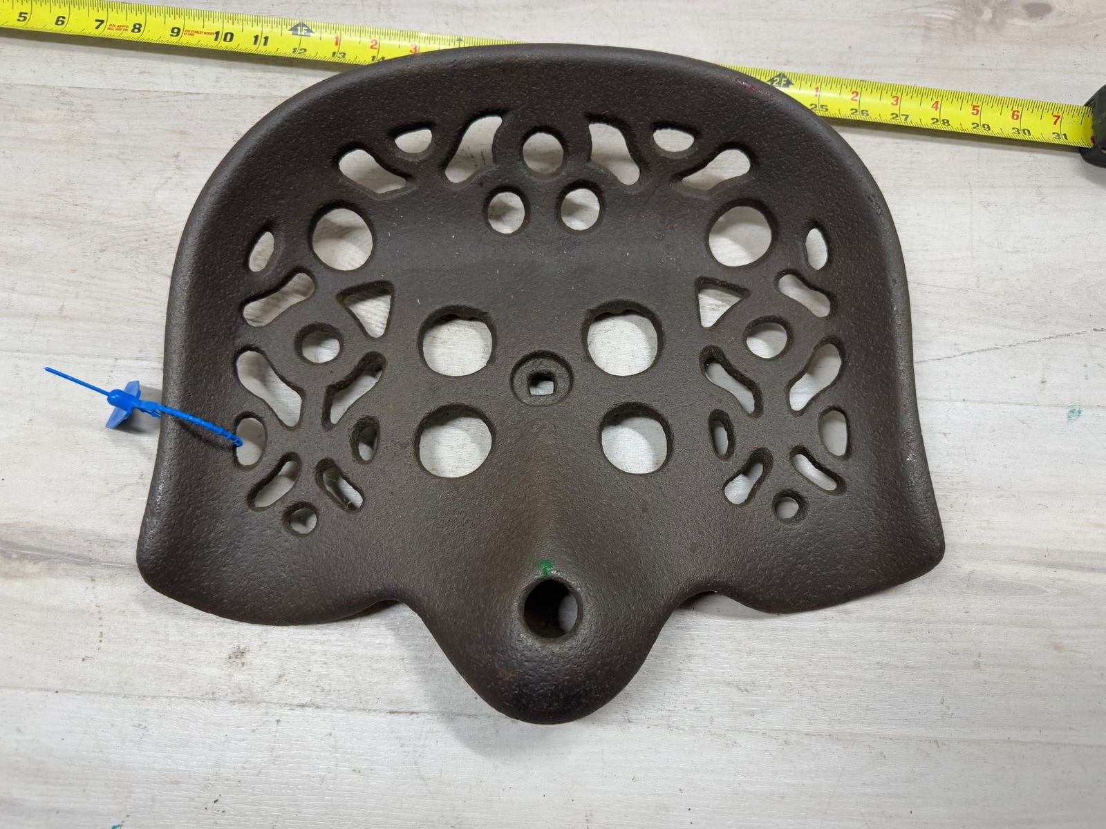Unmarked cast iron tractor/ implement seat (1 of 2)