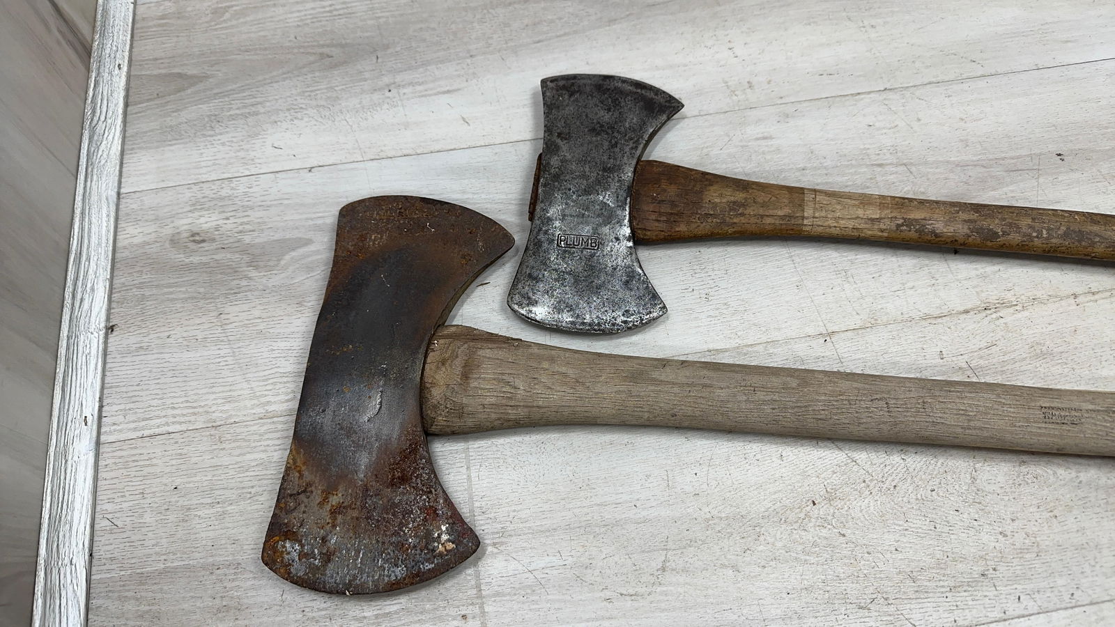 PAIR OF DOUBLE BIT AXES. 1 MARKED PLUMB: Load-out Pick up for all online purchases for Antiques & collectibles is Monday, Tuesday, Wednesday, February 23rd, 24th, 25th At our shipper's location. We do offer shipping on all items