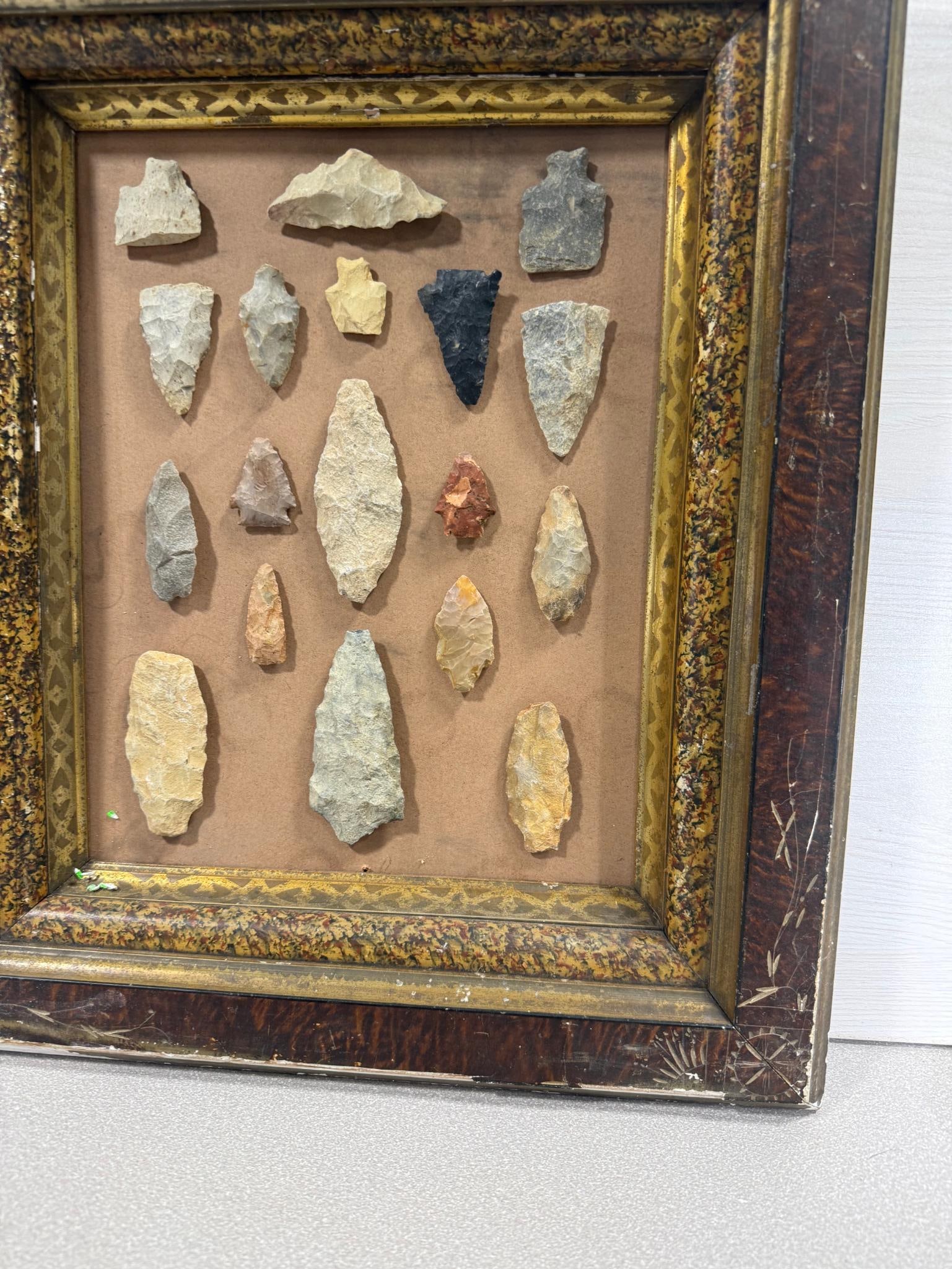 Arrowheads in antique frame - 2