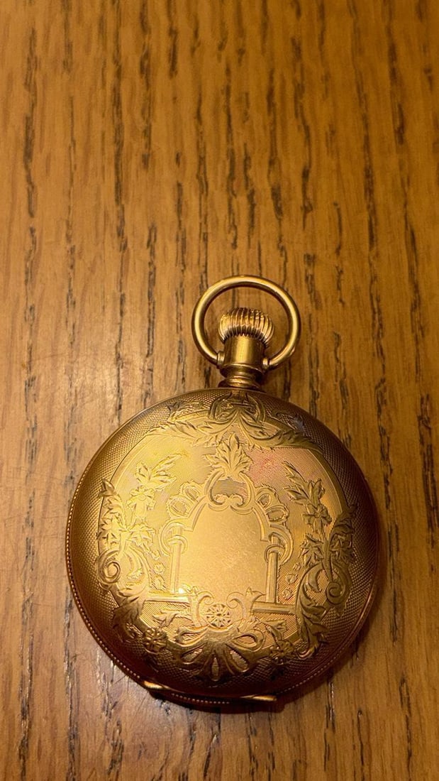 Elgin Pocket Watch, Serial 1411198, 1884, Gold-Filled, 18s, 7 Jewels: Elgin Pocket Watch with Serial Number 1411198, manufactured in 1884, features include a gold-filled case, Roman numeral dial, manual wind movement, hunting configuration, gilded movement finish, full