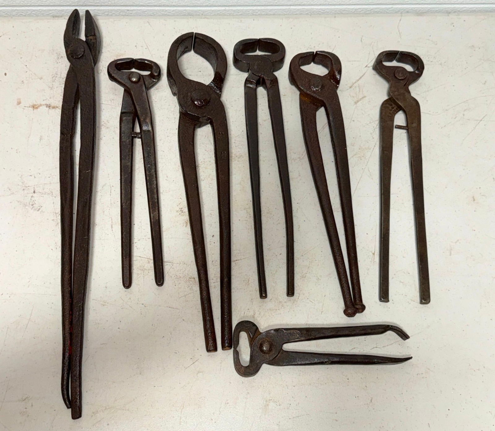 7 Pair of Blacksmith and Farrier Tongs, longest one is 21 inches long (1 of 7)