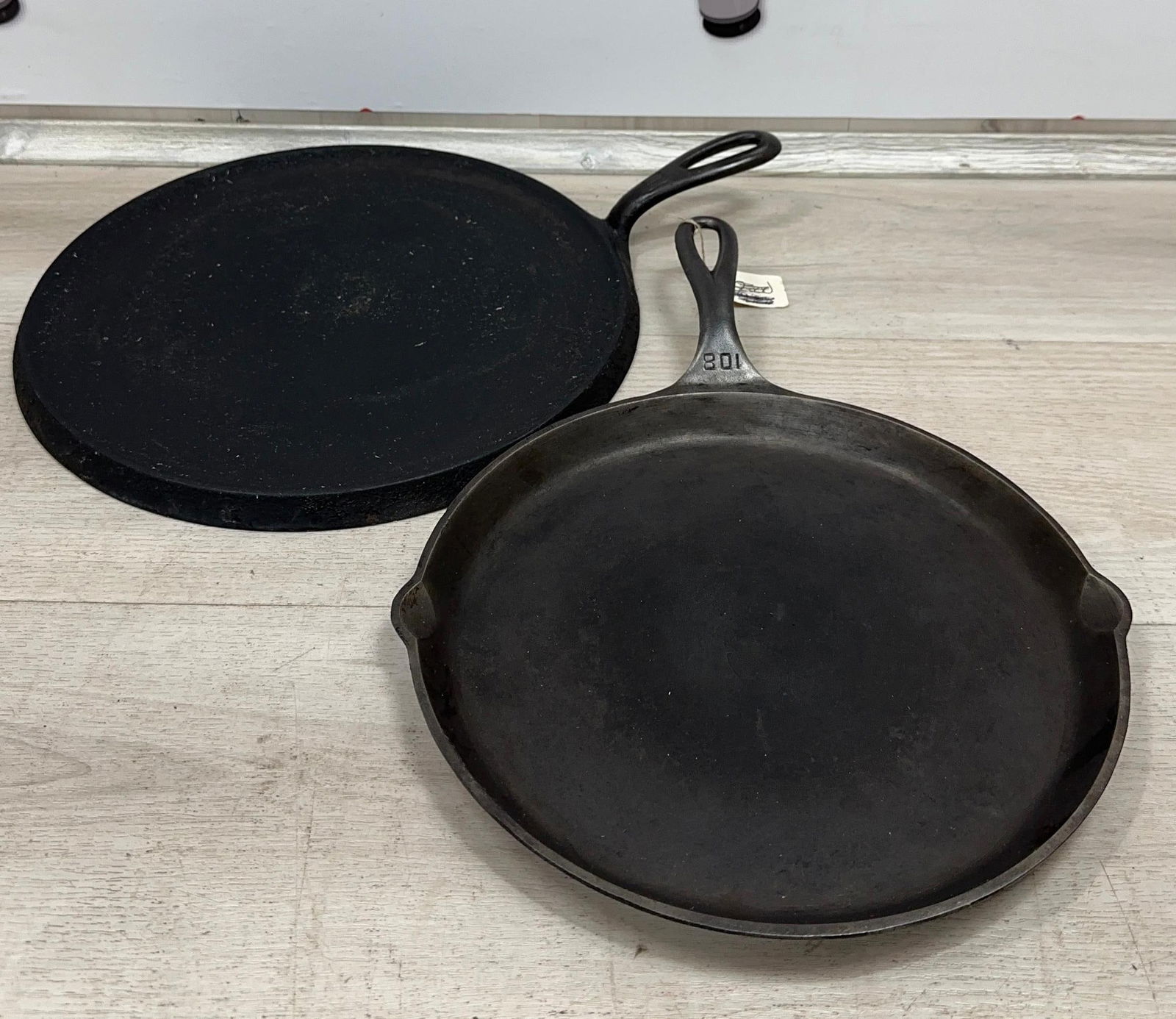 2 GRISWOLD LARGE BLOCK ROUND GRIDDLES. NO. 10 SITS FLAT AND NO. 108 HAS A CRACK AND WOBBLE: Load-out Pick up for all online purchases for Antiques & collectibles is Monday, Tuesday, Wednesday, February 23rd, 24th, 25th At our shipper's location. We do offer shipping on all items shippable wi