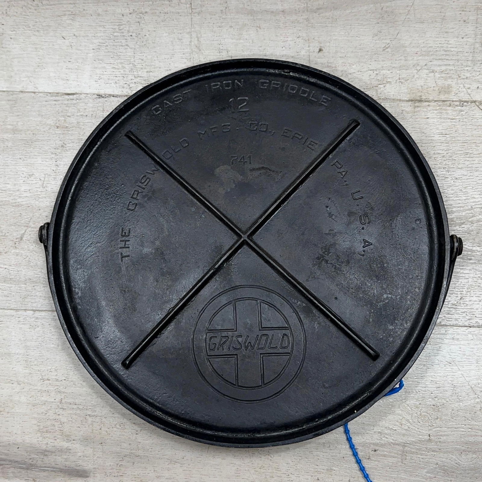 GRISWOLD NO. 12 SLANT LOGO ROUND GRIDDLE. WOBBLES: Load-out Pick up for all online purchases for Antiques & collectibles is Monday, Tuesday, Wednesday, February 23rd, 24th, 25th At our shipper's location. We do offer shipping on all items shippable