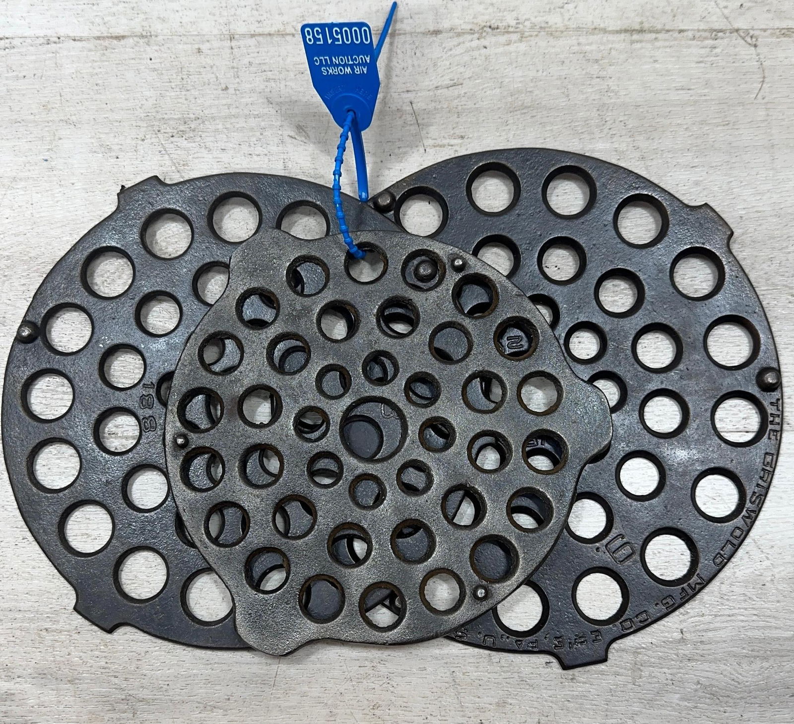 SET OF 3 TRIVETS. 8&9 GRISWOLD AND UNMARKED 7: Load-out Pick up for all online purchases for Antiques & collectibles is Monday, Tuesday, Wednesday, February 23rd, 24th, 25th At our shipper's location. We do offer shipping on all items shippable wi