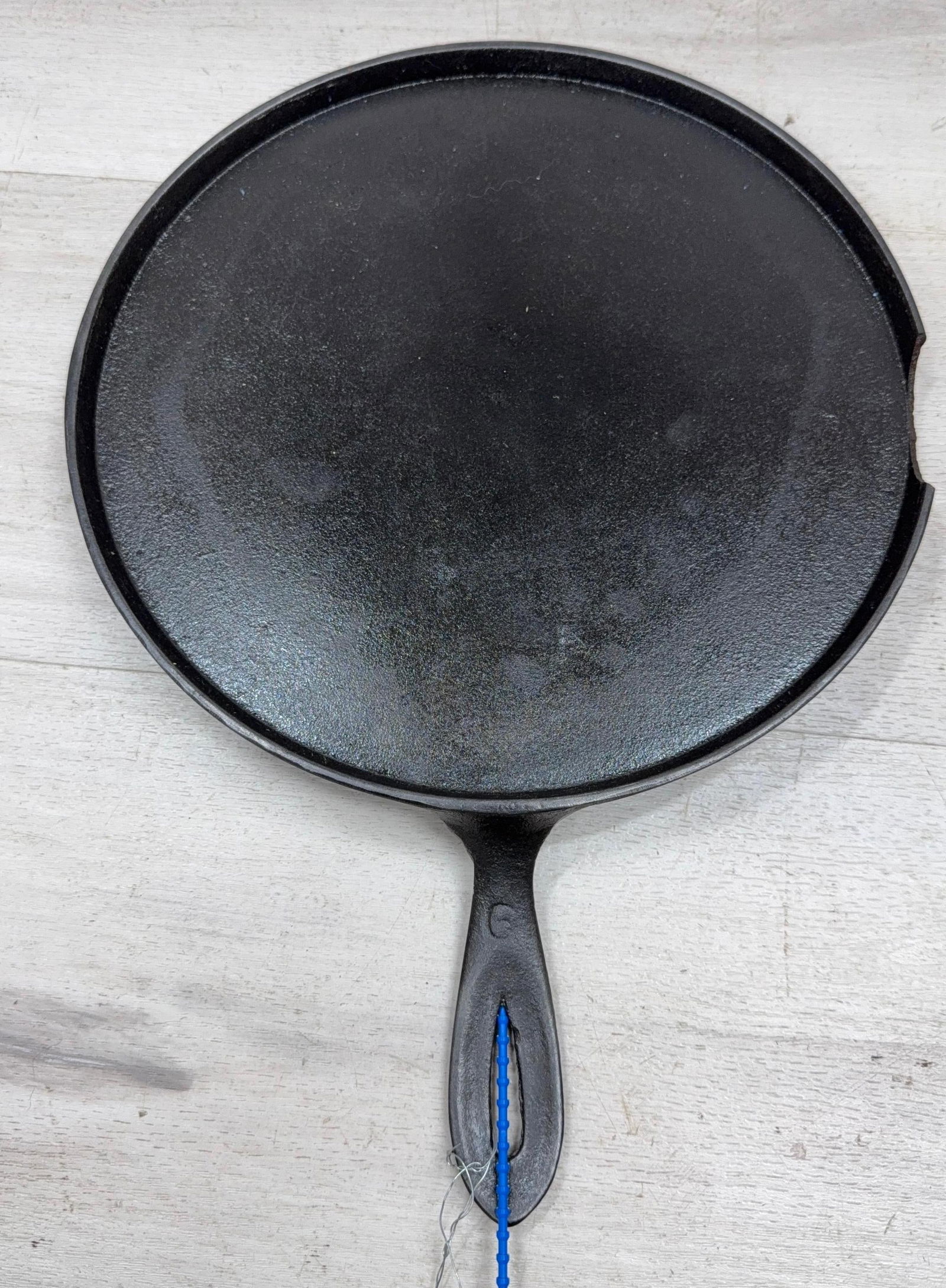 ERIE 10" FLAT SKILLET CHIPPED BOTTOM EDGE W/MISSING PIECE INCLUDED: Load-out Pick up for all online purchases for Antiques & collectibles is Monday, Tuesday, Wednesday, February 23rd, 24th, 25th At our shipper's location. We do offer shipping on all items shippable wi