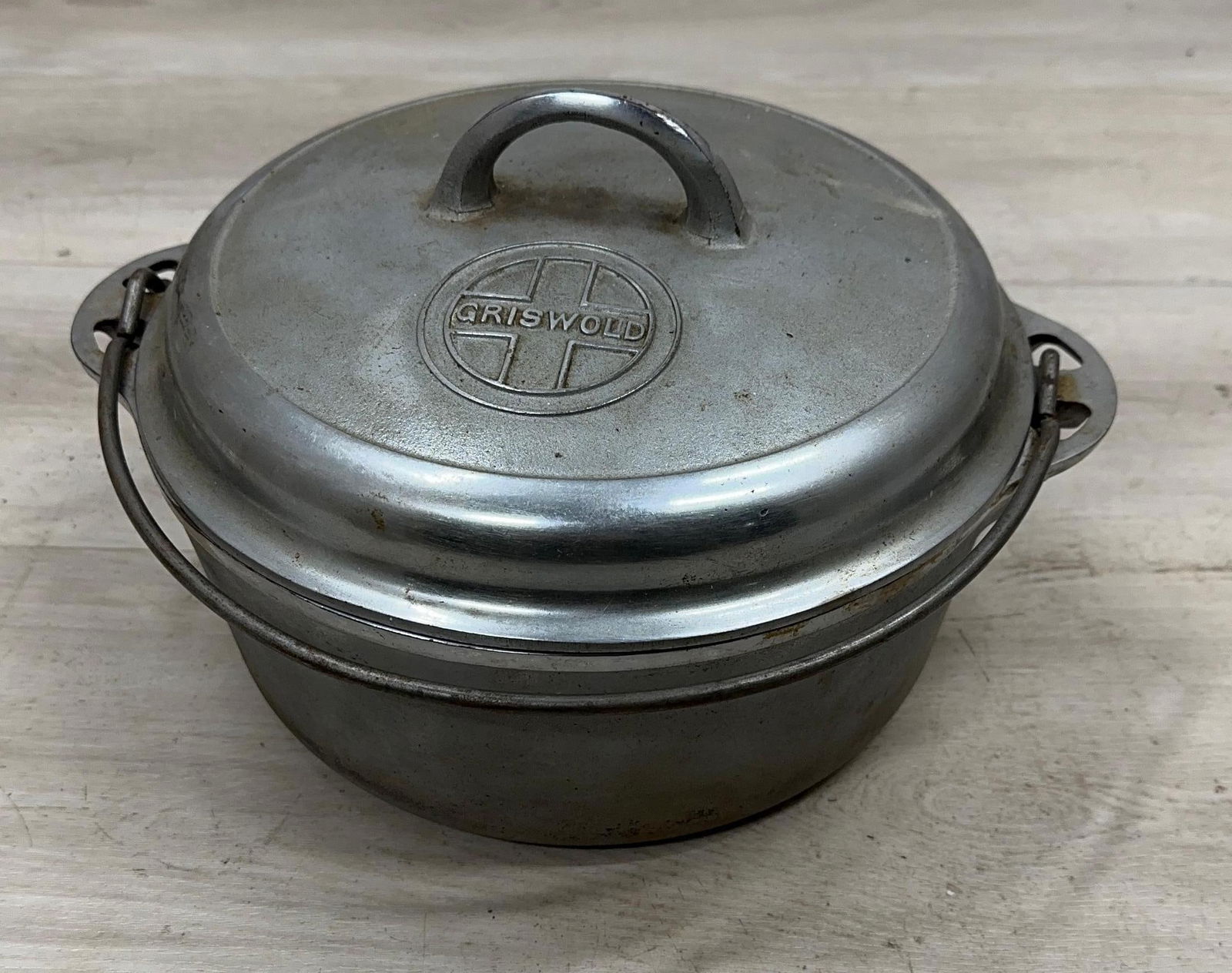 GRISWOLD NO. 8 CHROME DUTCH OVEN WITH BUTTON LID: Load-out Pick up for all online purchases for Antiques & collectibles is Monday, Tuesday, Wednesday, February 23rd, 24th, 25th At our shipper's location. We do offer shipping on all items shippable wi