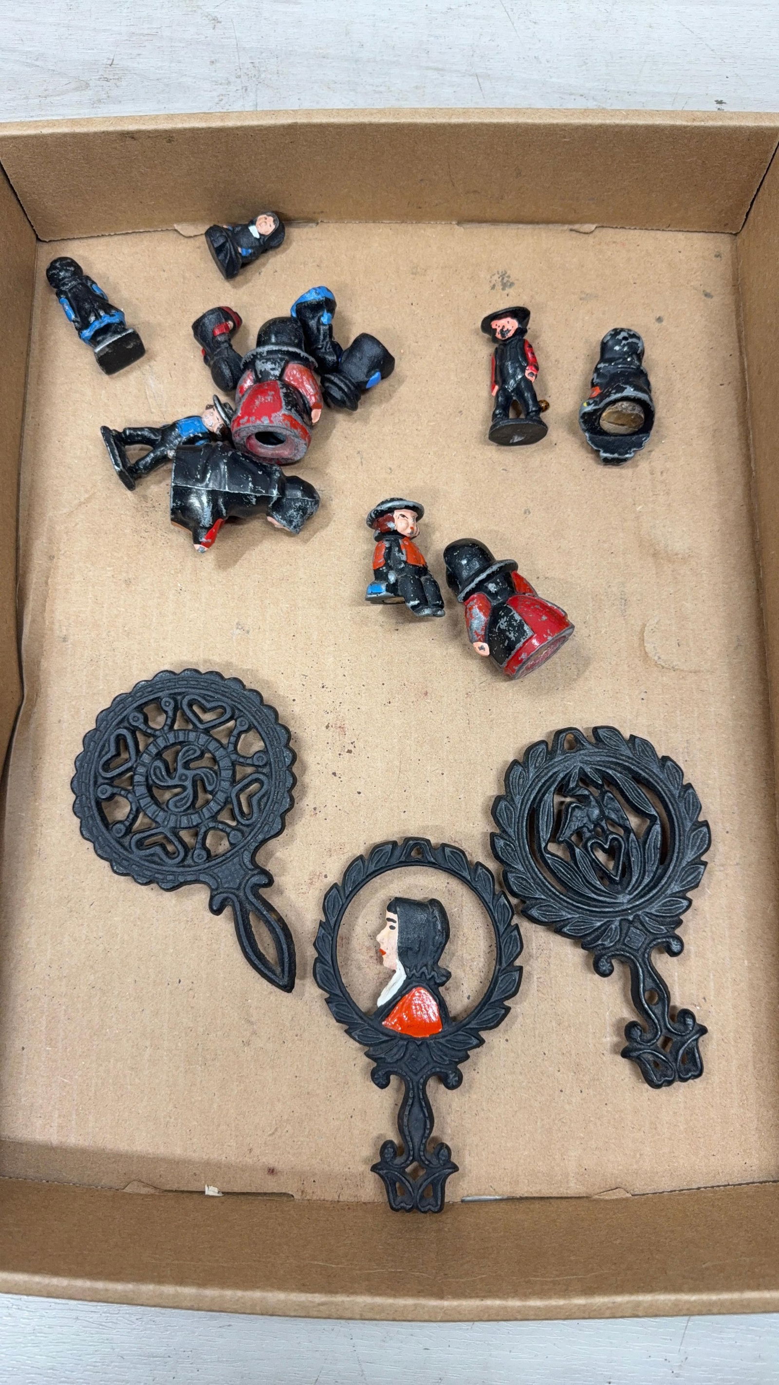 CAST IRON FIGURINES AND TRIVETS: Load-out Pick up for all online purchases for Antiques & collectibles is Monday, Tuesday, Wednesday, February 23rd, 24th, 25th At our shipper's location. We do offer shipping on all items shippable wi