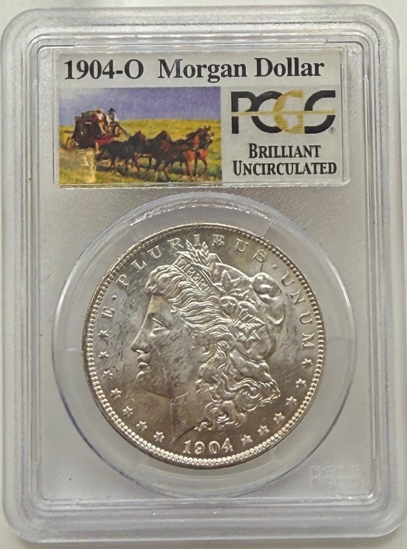 1904-O Morgan Dollar, PCGS Graded, Brilliant Uncirculated: IMPORTANT, WE ONLY ACCEPT CREDIT CARDS UP TO $500 FOR ONLINE COIN PURCHASES. YOU CAN PAY ACH THROUGH PROXIBID, OR YOU CAN SEND A WIRE OR CERTIFIED CHECK. WE WILL HOLD ALL SHIPPING OF COINS FOR 10 DAYS