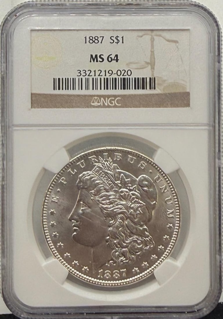 1887 Morgan Dollar Coin, NGC MS 64, Serial: 3321219-020: IMPORTANT, WE ONLY ACCEPT CREDIT CARDS UP TO $500 FOR ONLINE COIN PURCHASES. YOU CAN PAY ACH THROUGH PROXIBID, OR YOU CAN SEND A WIRE OR CERTIFIED CHECK. WE WILL HOLD ALL SHIPPING OF COINS FOR 10 DAYS