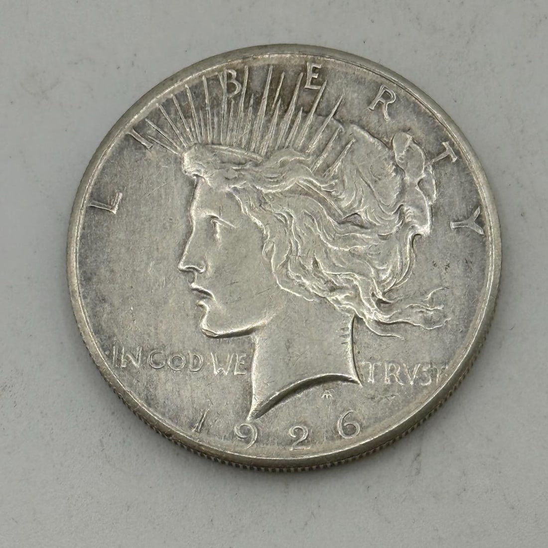 1926 Peace Silver Dollar Coin, 90% Silver: IMPORTANT, WE ONLY ACCEPT CREDIT CARDS UP TO $500 FOR ONLINE COIN PURCHASES. YOU CAN PAY ACH THROUGH PROXIBID, OR YOU CAN SEND A WIRE OR CERTIFIED CHECK. WE WILL HOLD ALL SHIPPING OF COINS FOR 10 DAYS