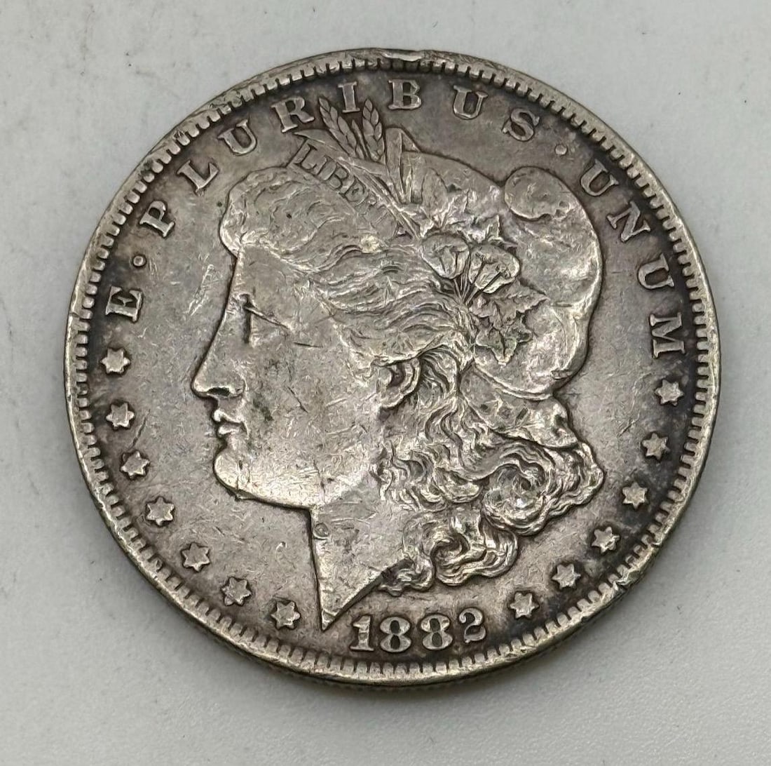 1882-CC Morgan Dollar Coin, United States, 90% Silver: IMPORTANT, WE ONLY ACCEPT CREDIT CARDS UP TO $500 FOR ONLINE COIN PURCHASES. YOU CAN PAY ACH THROUGH PROXIBID, OR YOU CAN SEND A WIRE OR CERTIFIED CHECK. WE WILL HOLD ALL SHIPPING OF COINS FOR 10 DAYS