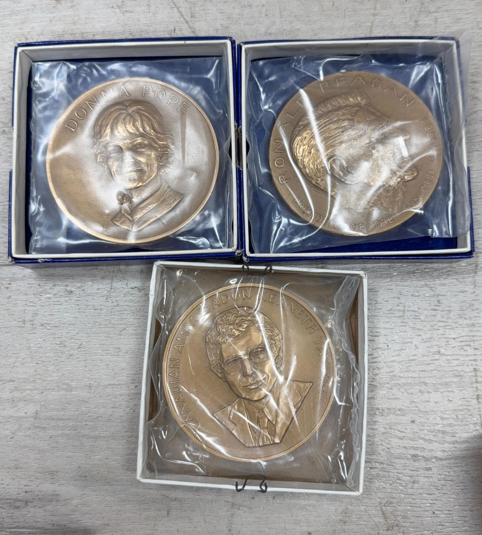 SET OF 3 BRONZE MEDALS REAGAN AND OTHERS: IMPORTANT, WE ONLY ACCEPT CREDIT CARDS UP TO $500 FOR ONLINE COIN PURCHASES. YOU CAN PAY ACH THROUGH PROXIBID, OR YOU CAN SEND A WIRE OR CERTIFIED CHECK. WE WILL HOLD ALL SHIPPING OF COINS FOR 10 DAYS
