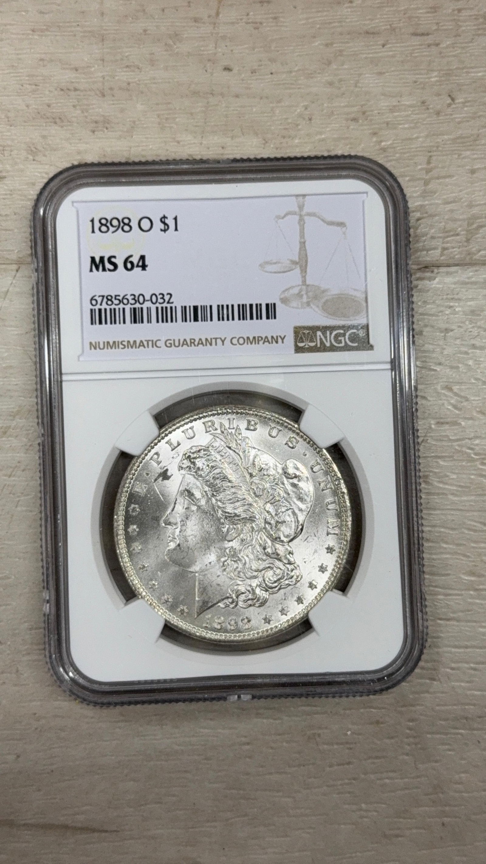 1898 O Morgan Dollar, NGC MS 64, Serial: 6785630-032: IMPORTANT, WE ONLY ACCEPT CREDIT CARDS UP TO $500 FOR ONLINE COIN PURCHASES. YOU CAN PAY ACH THROUGH PROXIBID, OR YOU CAN SEND A WIRE OR CERTIFIED CHECK. WE WILL HOLD ALL SHIPPING OF COINS FOR 10 DAYS