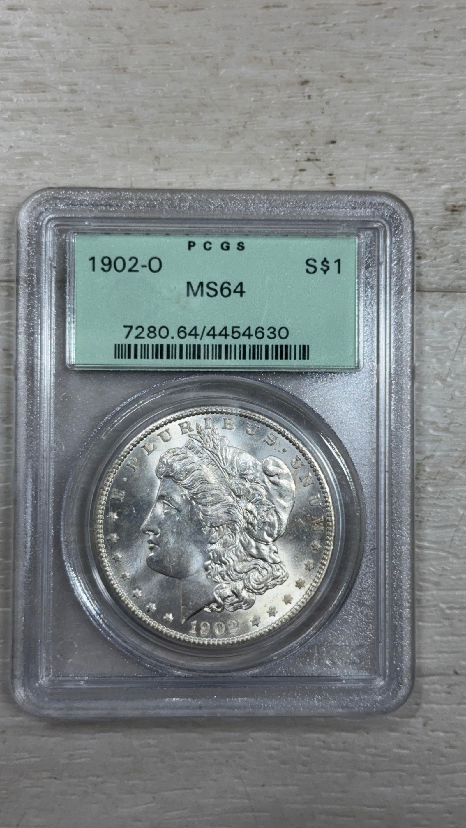 1902-O Morgan Dollar Coin, MS64, PCGS Certified, Serial: 7280.64/4454630: IMPORTANT, WE ONLY ACCEPT CREDIT CARDS UP TO $500 FOR ONLINE COIN PURCHASES. YOU CAN PAY ACH THROUGH PROXIBID, OR YOU CAN SEND A WIRE OR CERTIFIED CHECK. WE WILL HOLD ALL SHIPPING OF COINS FOR 10 DAYS