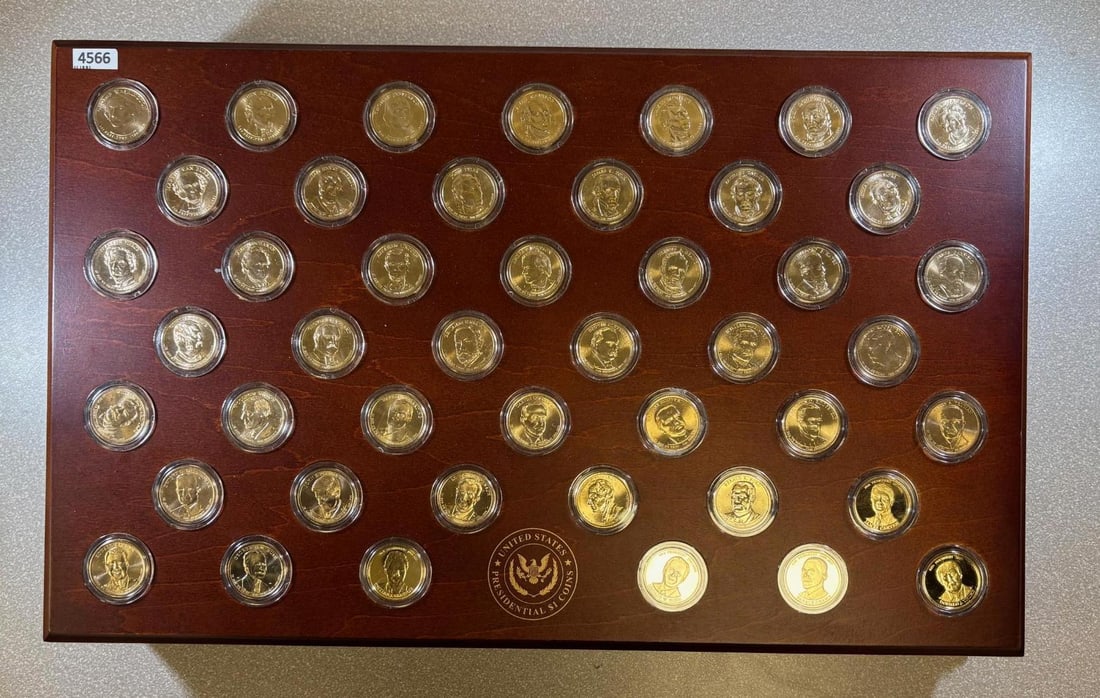 Wooden Presidential box w/ Presidential dollars, and rolls of coins inside: This set includes one of each Presidential dollar coins from the US mint w/ a few tokens for living presidents Such as Obama, Trump, Bush, Clinton. Inside is a roll of each containing 10 coins, of the
