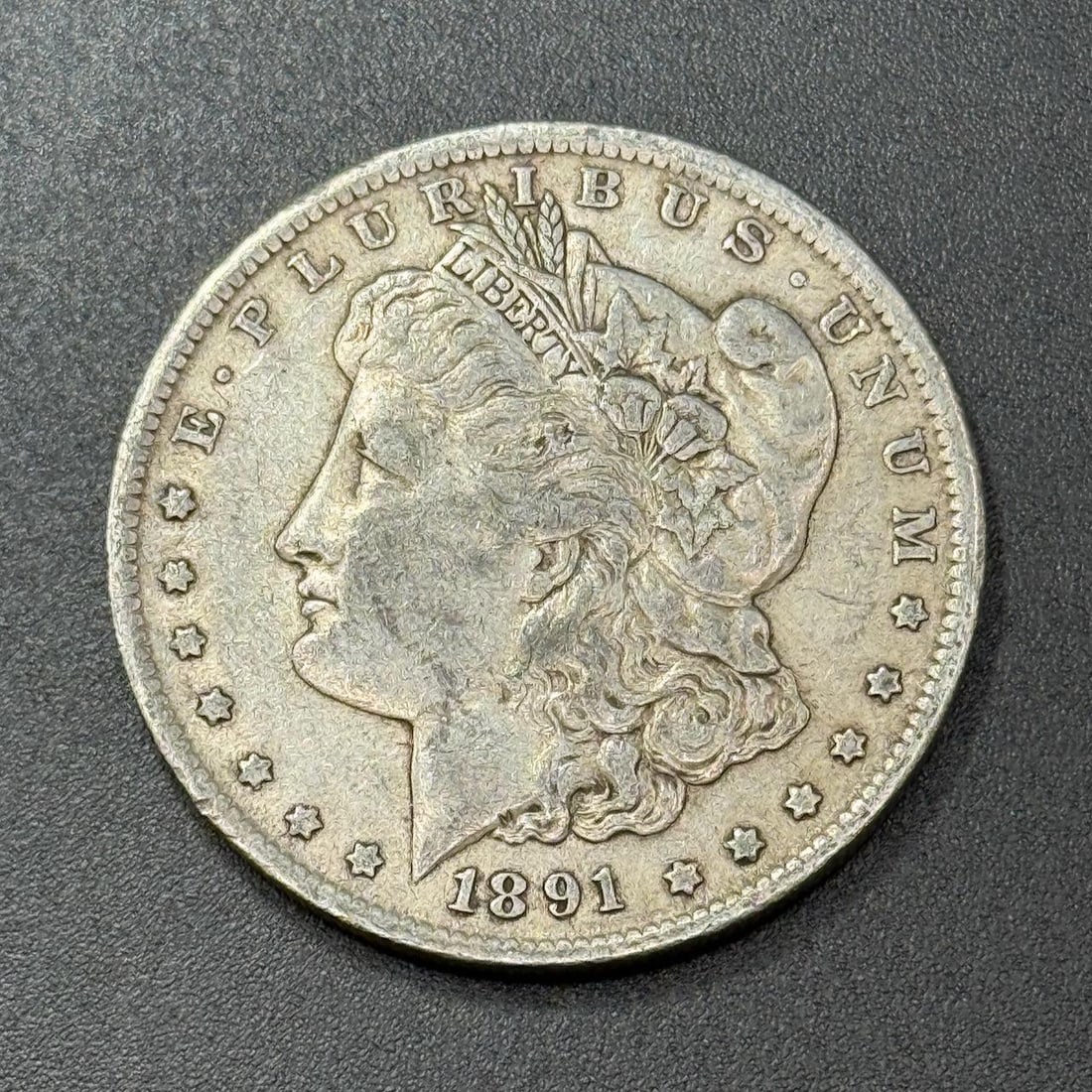 1891 Morgan Dollar Coin, United States, 90% Silver: IMPORTANT, WE ONLY ACCEPT CREDIT CARDS UP TO $500 FOR ONLINE COIN PURCHASES. YOU CAN PAY ACH THROUGH PROXIBID, OR YOU CAN SEND A WIRE OR CERTIFIED CHECK. WE WILL HOLD ALL SHIPPING OF COINS FOR 10 DAYS