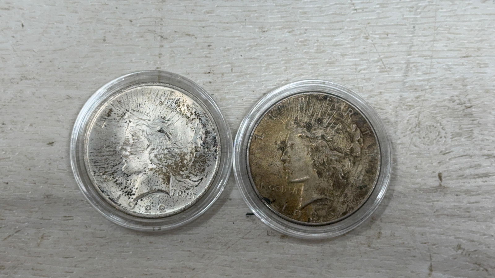 1922 and 1935 Peace Silver Dollars, 90% silver: IMPORTANT, WE ONLY ACCEPT CREDIT CARDS UP TO $500 FOR ONLINE COIN PURCHASES. YOU CAN PAY ACH THROUGH PROXIBID, OR YOU CAN SEND A WIRE OR CERTIFIED CHECK. WE WILL HOLD ALL SHIPPING OF COINS FOR 10 DAYS