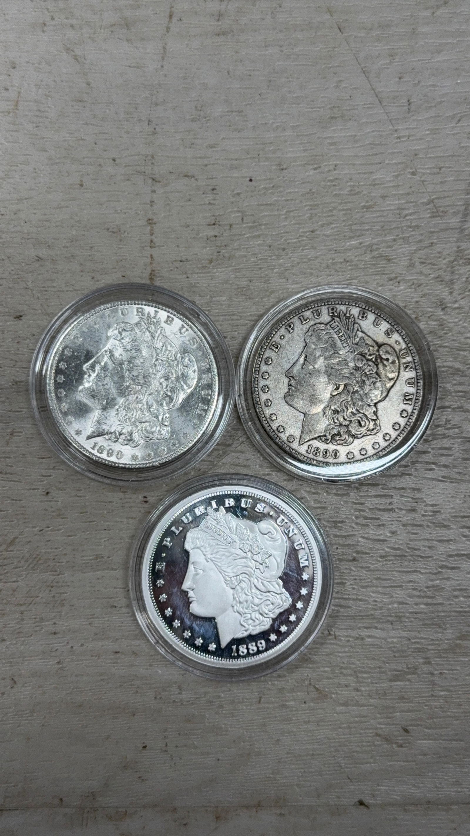 2- US Morgan Silver Dollars, 1890, 1890-O and one COPY token: IMPORTANT, WE ONLY ACCEPT CREDIT CARDS UP TO $500 FOR ONLINE COIN PURCHASES. YOU CAN PAY ACH THROUGH PROXIBID, OR YOU CAN SEND A WIRE OR CERTIFIED CHECK. WE WILL HOLD ALL SHIPPING OF COINS FOR 10 DAYS