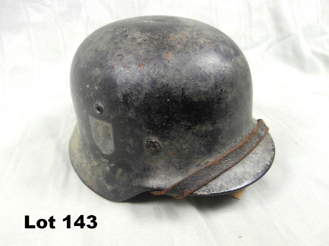 German WWII Black Allgemeine SS Camo Helmet M-35: German WWII Black Allgemeine SS camo helmet m-35. There is a name "kurzlechner" in it size 58 shell "egg" liner "1939" date with chin strap
