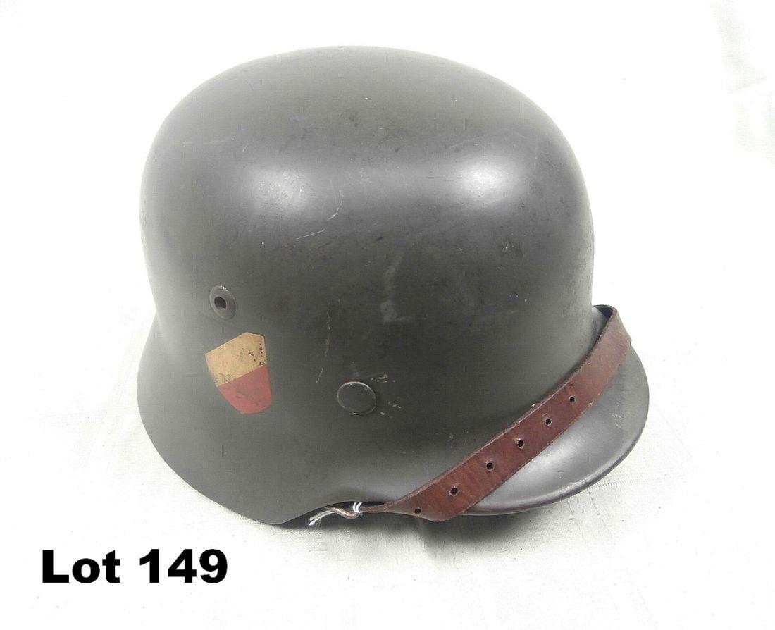 German WWII Double Decal Helmet: German WWII double decal helmet marked E142 in back with liner and chin strap