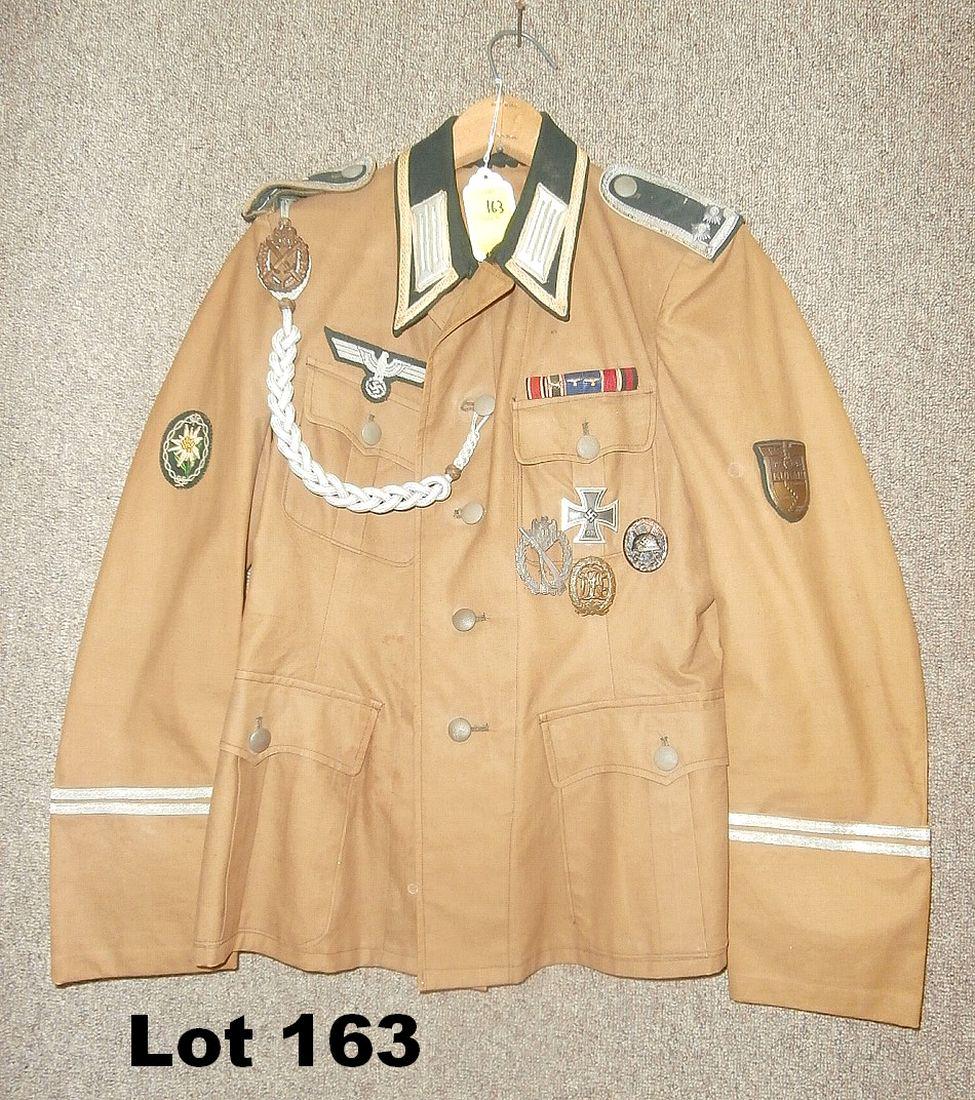 German WWII Dress Jacket With Lots Of Badges: German WWII Dress jacket with lots of badges incs iron cross first class, tabs, etc.