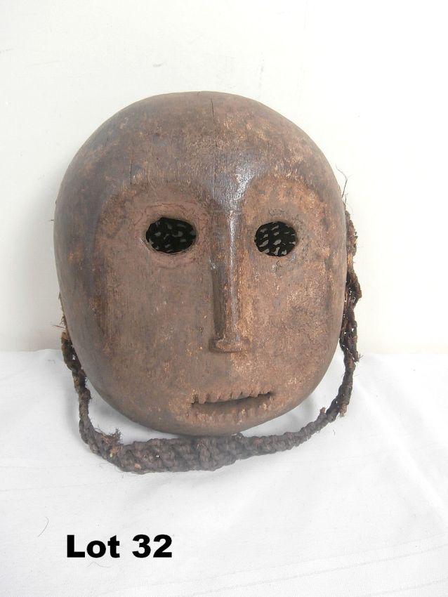 Wood Carved Mask with Braided Rope Hair: Wood Carved Mask with Braided Rope Hair. 10.5" tall.
