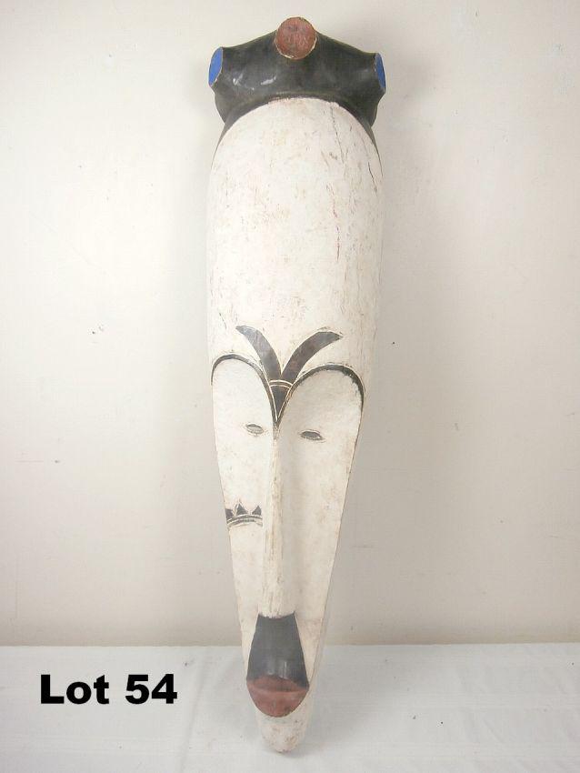 Carved Wooden Painted Mask: Carved wooden painted mask. 41" tall.