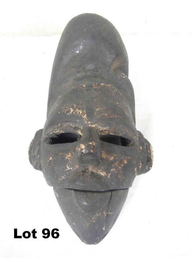 Carved Mask with Movable Jaw: Carved wooden mask with movable jaw. 9.5" tall.