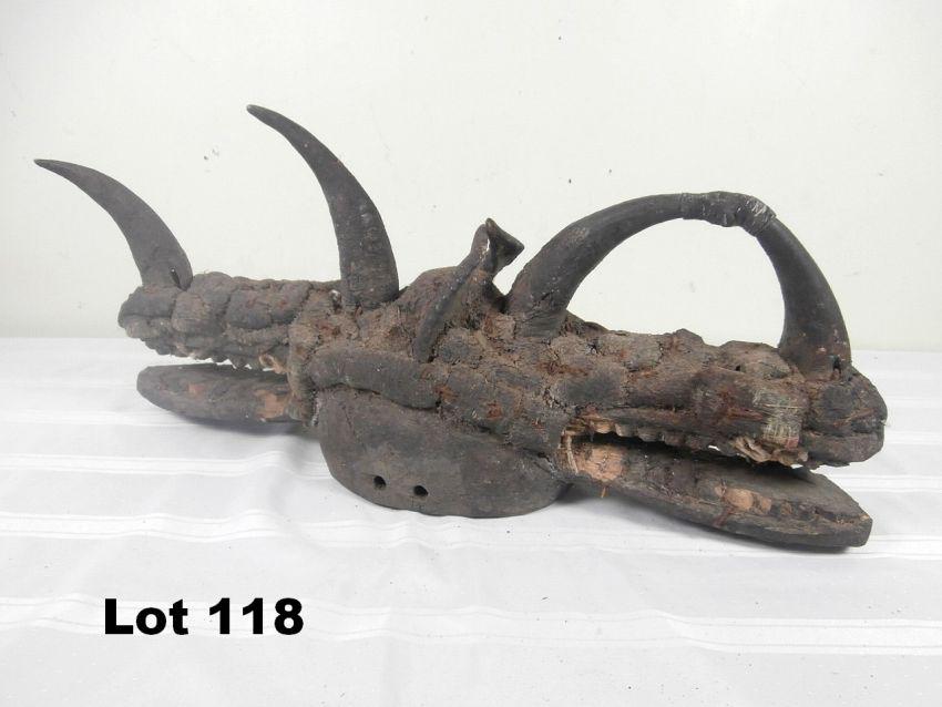 Double-Sided Sculpture of Opposing Serpents: Double-sided sculpture of opposing serpents. Embedded horns and cracked mirrors decorations. 27" long.