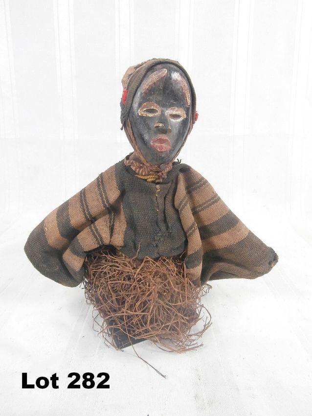 Carved Doll-Like Figure: Carved doll-like figure. Painted face, 9" tall.