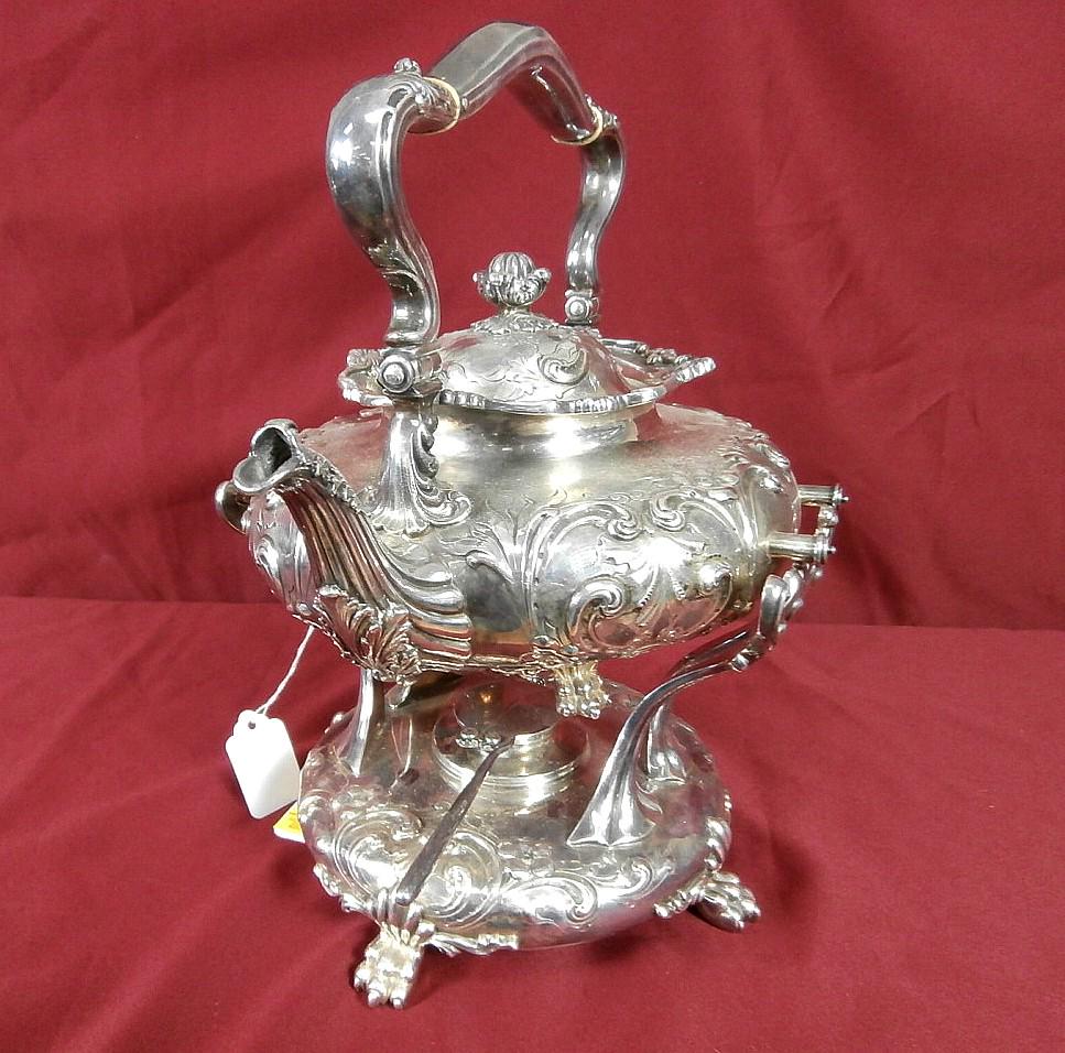 Sterling Silver Tip Teapot on Stand: Sterling tip teapot on stand. Ornate floral design, claw feet. 74.5 troy oz.