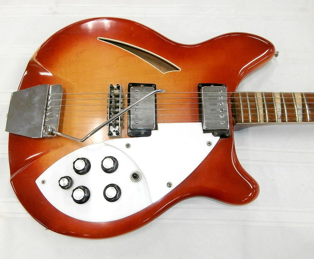 Rickenbacker 1960's 365 Fireglow 6-String Guitar: Rickenbacker 1960's 365 Fireglow 6-string guitar with case. Stamped "FD 1260" on output jack. Separation of wood on head, paint has some light wear.