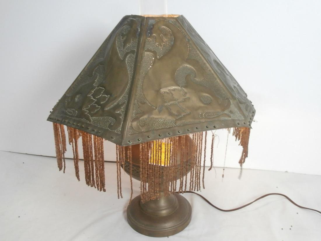 Vintage beaded table lamp with repeated Dolphin motif: Aprox. 20 Inches tall. Noticable loss to bead work, several strands missing. As is.