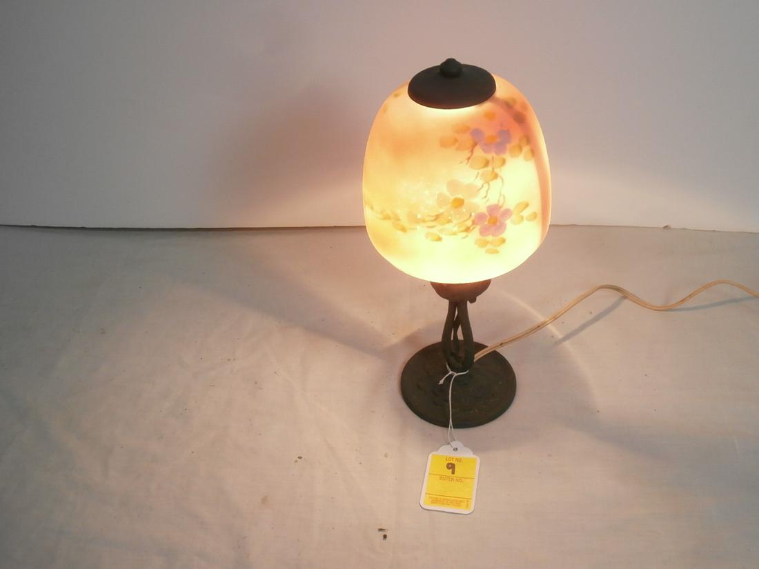 In the Style of Moe Bridges unsigned table lamp: Aprox. 12.5 inches tall. Frosted painted floral shade.