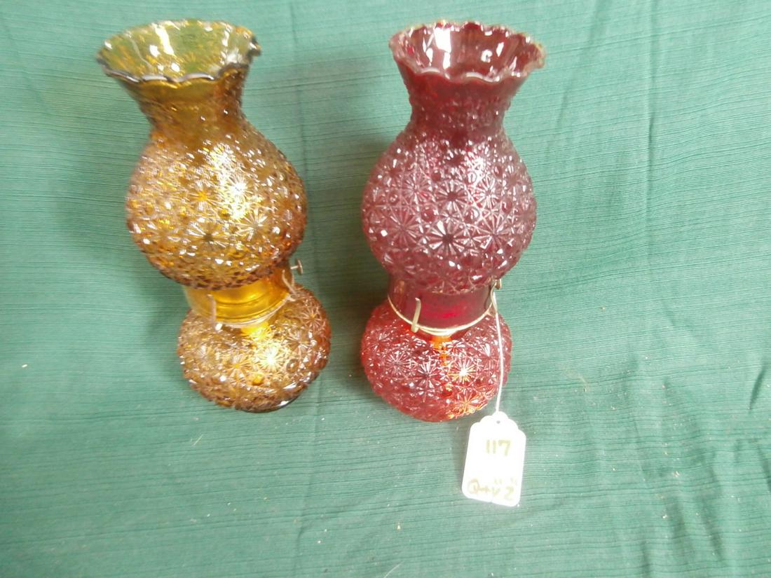 2 Button and Daisy glass oil lamps. One amber, 1 red: Aprox. 12 inches tall