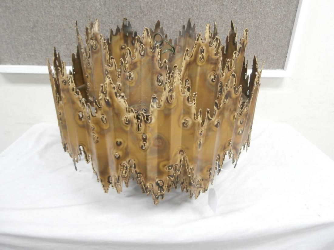 Brutalist Chandelier: Mid Centyury Modern Design, in the Style of Tom Greene. All hand done. Retains tag that reads: Distrubuted by the Feldman Company. Orig. Purchase Price $4800.00 There are some bends in the metal. Apro