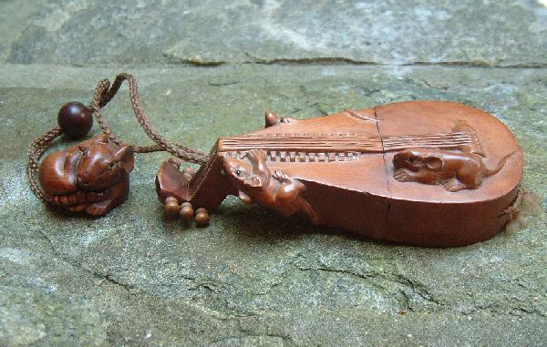 Japanese Inro rat netsuke: Contemporary Japanese Inro rat with matching rat netsuke. Signed.Measures 5 inches long with a netsuke that measures 1.25 inches. Beautifull carving detail