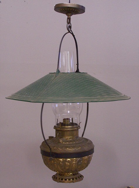 Hanging brass kerosene lantern: Victorian hanging brass kerosene lantern c1880. This light fixture measures 28f inches from the base to the top ceiling cover, 21 inch shade. Very good original condition. Electrified.