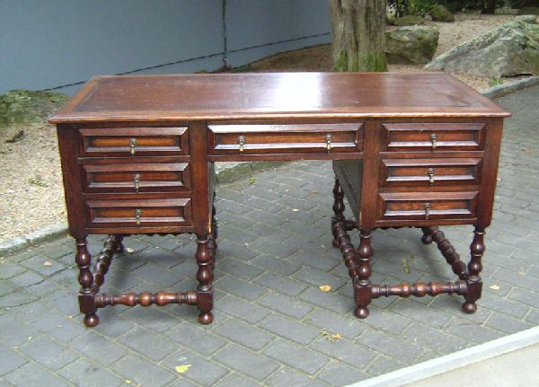 Jacobean style desk flat top: Jacobean style flat top partners desk, leather surface, center drawer with 3 drawers on each side, molded drawer fronts, dovetailed joints, bulbous-turned legs, circa 1900, 58" W x 27" D x 31" H