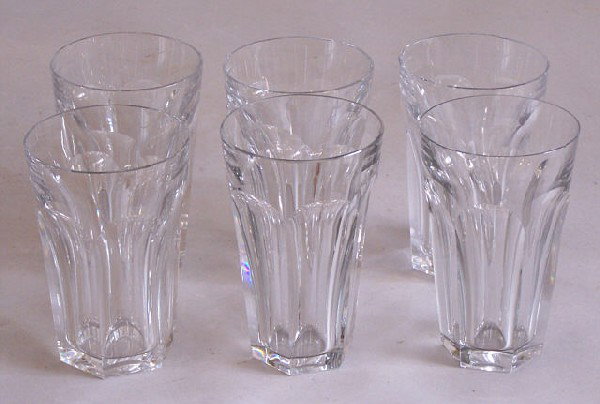 Baccarat crystal drinking glasses: Set of six Baccarat crystal drinking glasses. All six are signed on their bases. One glass has a tiny flea speak on its rim and one has a tiny flea chip on its base. The other four are perfect. Each g