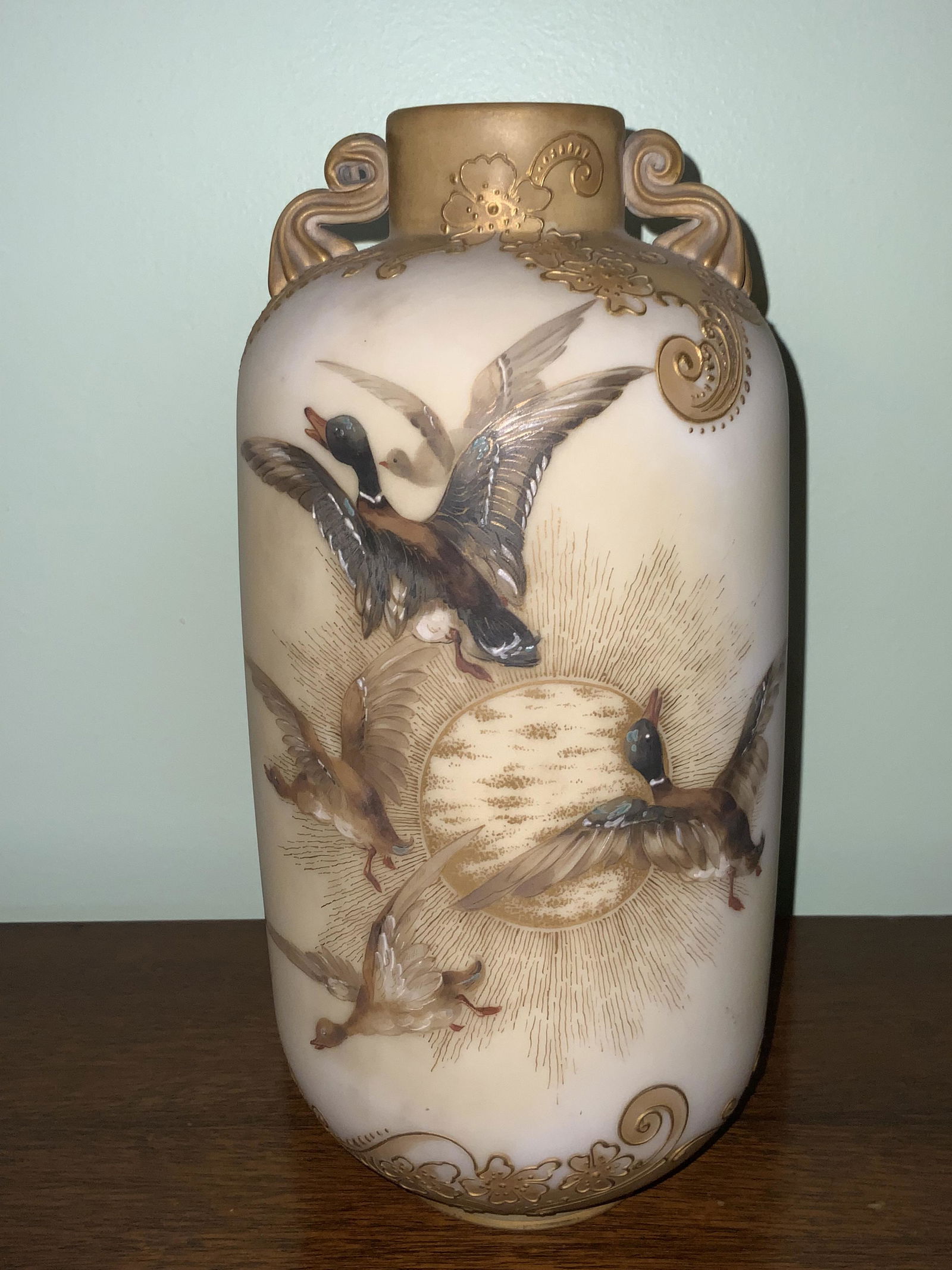 Mt. Washington Double Handled Vase: With duck detail on the front and back. The bottom has been drilled for a lamp. 11.5 inches tall