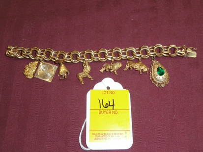 14kt Gold Charm Bracelet with 7 charms: 14kt Gold Charm Bracelet with 7 charms, 63.4 dwt