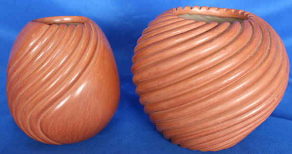 Pair of Native Jemez Pottery Swirled Coiled Jars By Damian Toya With Signature: Dimensions: 6"H x 7 1/2"Dia. & 6"H x 5 1/2"Dia.Artist: Damian ToyaSigned handcrafted Native American clay jars one with swirled coil design on whole piece and one with swirled coil design on one