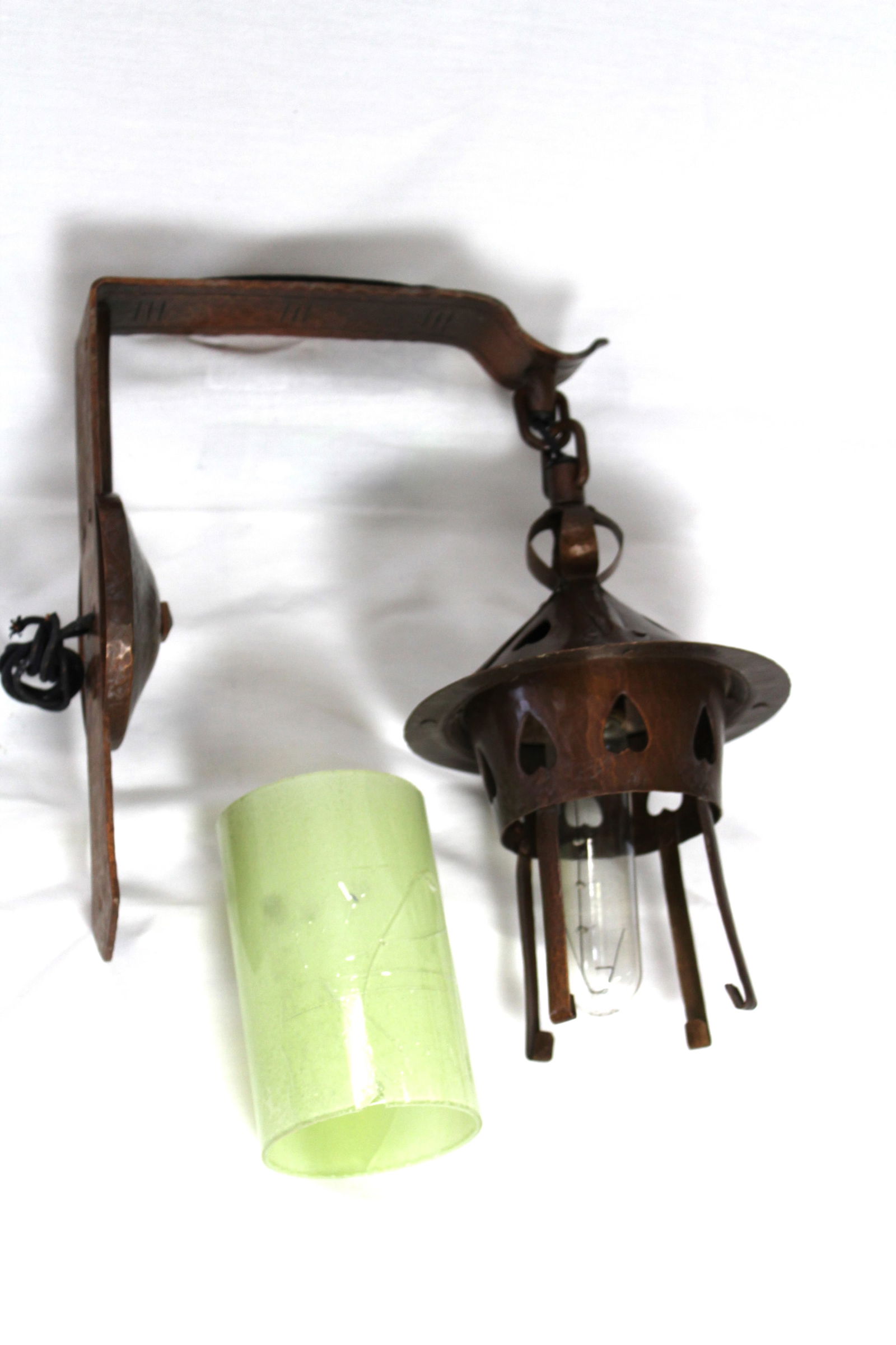 Aurora Studios Michael Adams Handcraft Wall Sconce: Hand hammered copper with heart cutout Green case glass shade as is cracked and taped Shade is 10 inches long Arm is 9.5 inches off of the wall and is 10.5 inches long The shade is 10 inches long