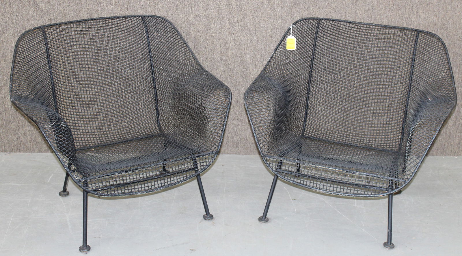 Pair Large Russell Woodard Sculptura Arm Chairs: Pair Large Russell Woodard Sculptura Arm Chairs. They are black painted with a great woven mesh design. They measure 33.25" at the widest the back is 28" tall. Some paint loss from many years of use.