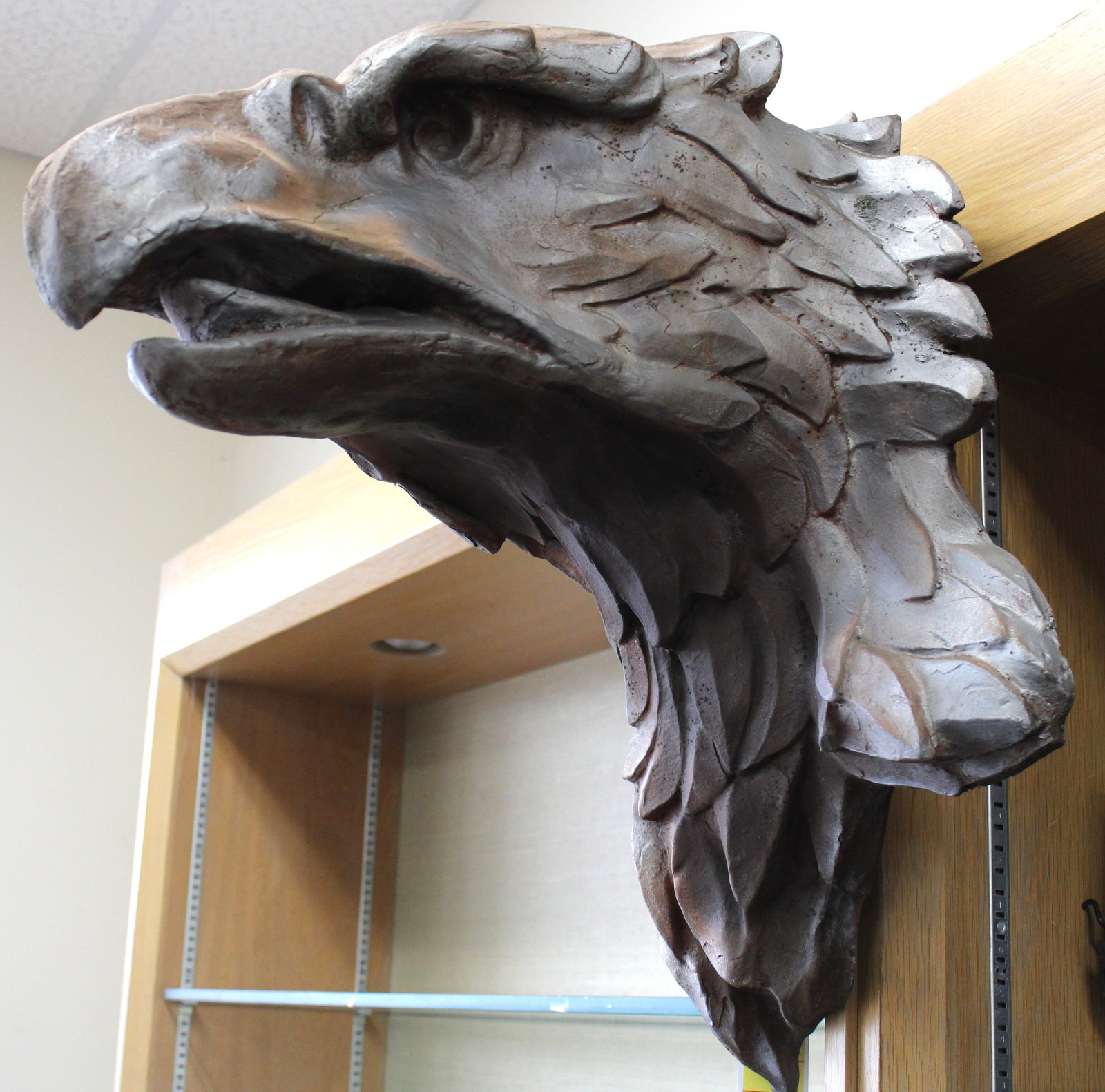 Bill Huebbe Fiberglass Grand Central Station Eagle: Bill Huebbe fiberglass Grand Central Station Eagle. Cast from the eagle head at Grand Central Station in NYC. Eagle measures 24" tall x 18" wide and it comes off the wall at 21" deep.