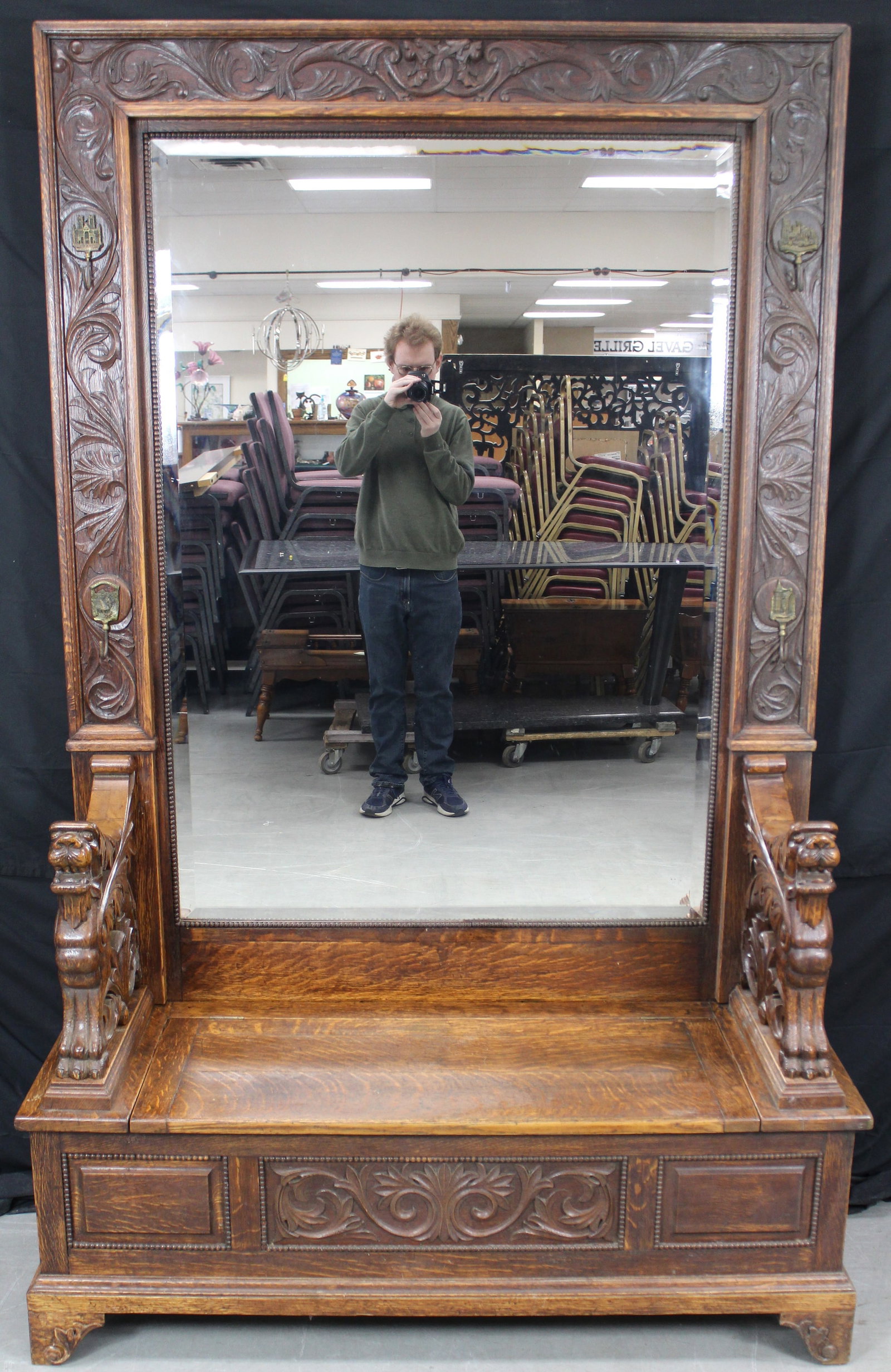 RJ Horner Carved Griffin Arm Hall Bench With Mirror: RJ Horner Carved Griffin Arm Hall Bench With Mirror. Bench has full bodied grotesques. The mirror is ornatley carved with two lions on top in the center. There is also hangers that each have metal dep