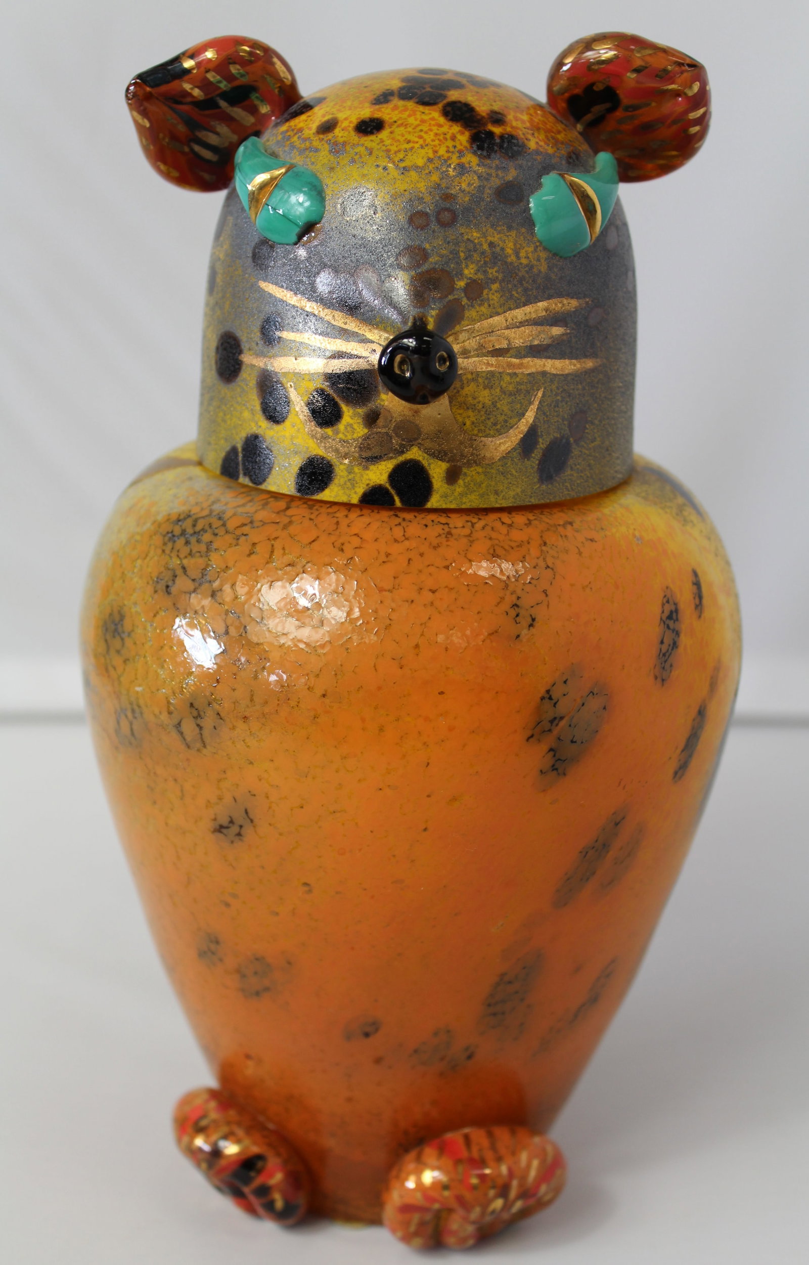 Monica Backstrom for Kosta Boda Covered Cheetah Jar: Monica Backstrom for Kosta Boda Covered Cheetah Jar. This is a really ornate and colorful jar. It is signed and dated on the bottom etched signature and numbered 8326671 dated 1997. A few extremely ti