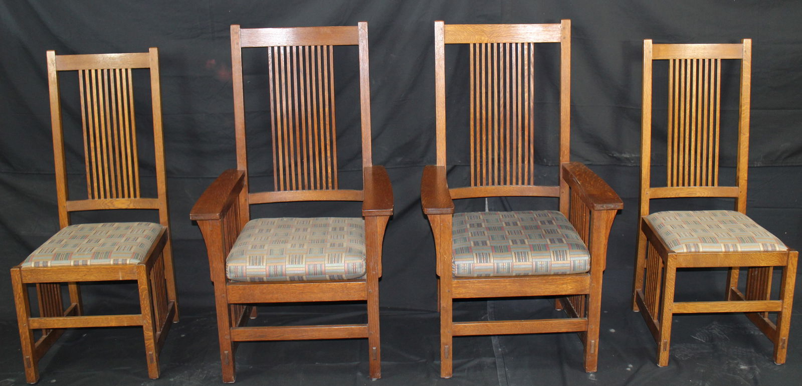 4 Mission Stickley Chairs: 4 Mission Stickley Chairs. Mission Oak Contemporary, 2 armchairs and 2 sidechairs. Metal label reads Stickley Handcraft Craftsmen Manlius, NY. Shows some wear from use.